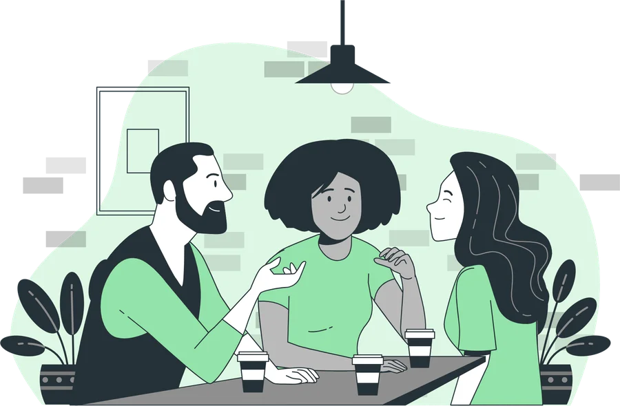 Tres personas conversando alrededor de una mesa